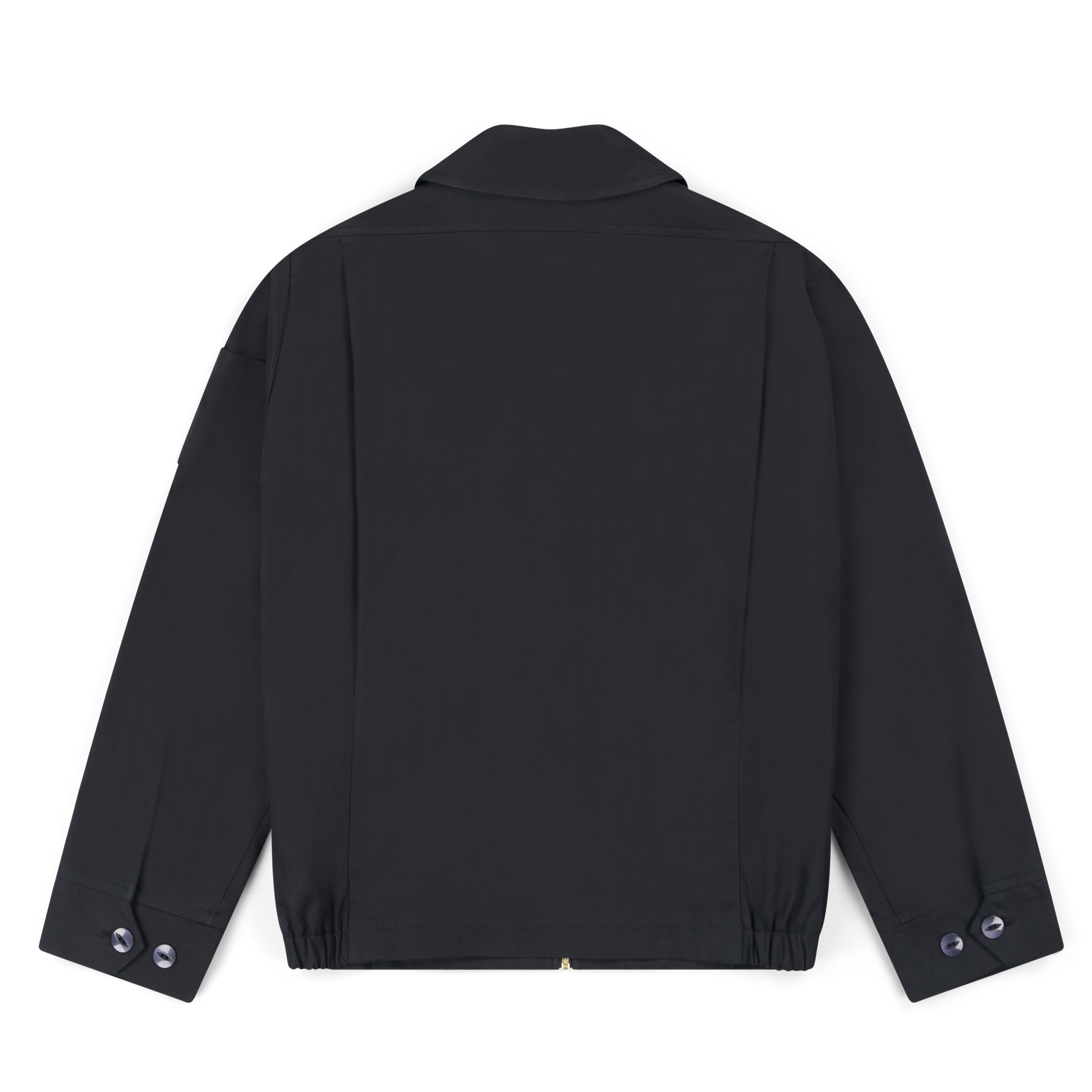 Robbyn unisex black workwear jacket shown from the back, featuring a boxy fit, reinforced seams, adjustable buttoned cuffs, and minimal detailing.