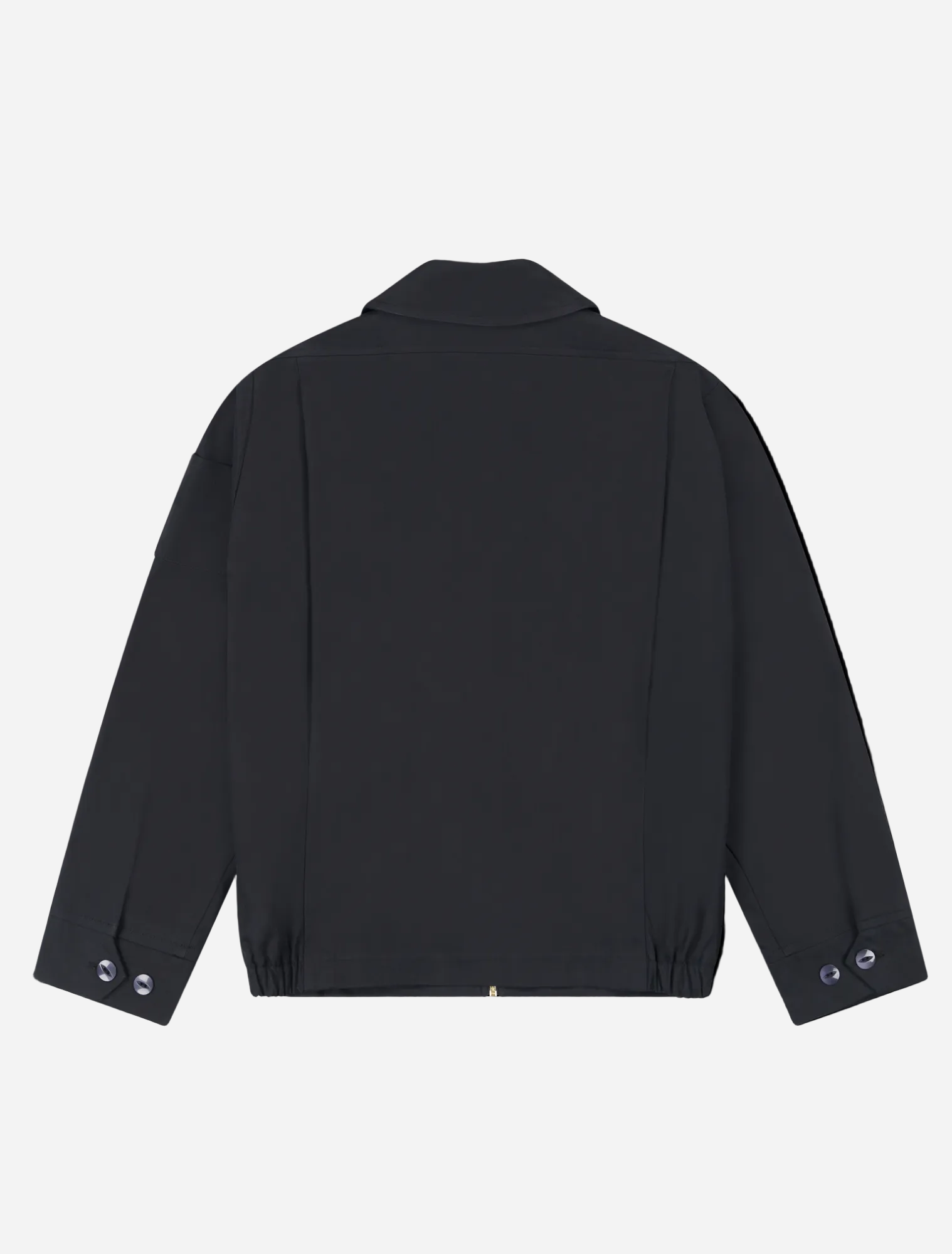 Robbyn unisex black workwear jacket shown from the back, featuring a boxy fit, reinforced seams, adjustable buttoned cuffs, and minimal detailing.