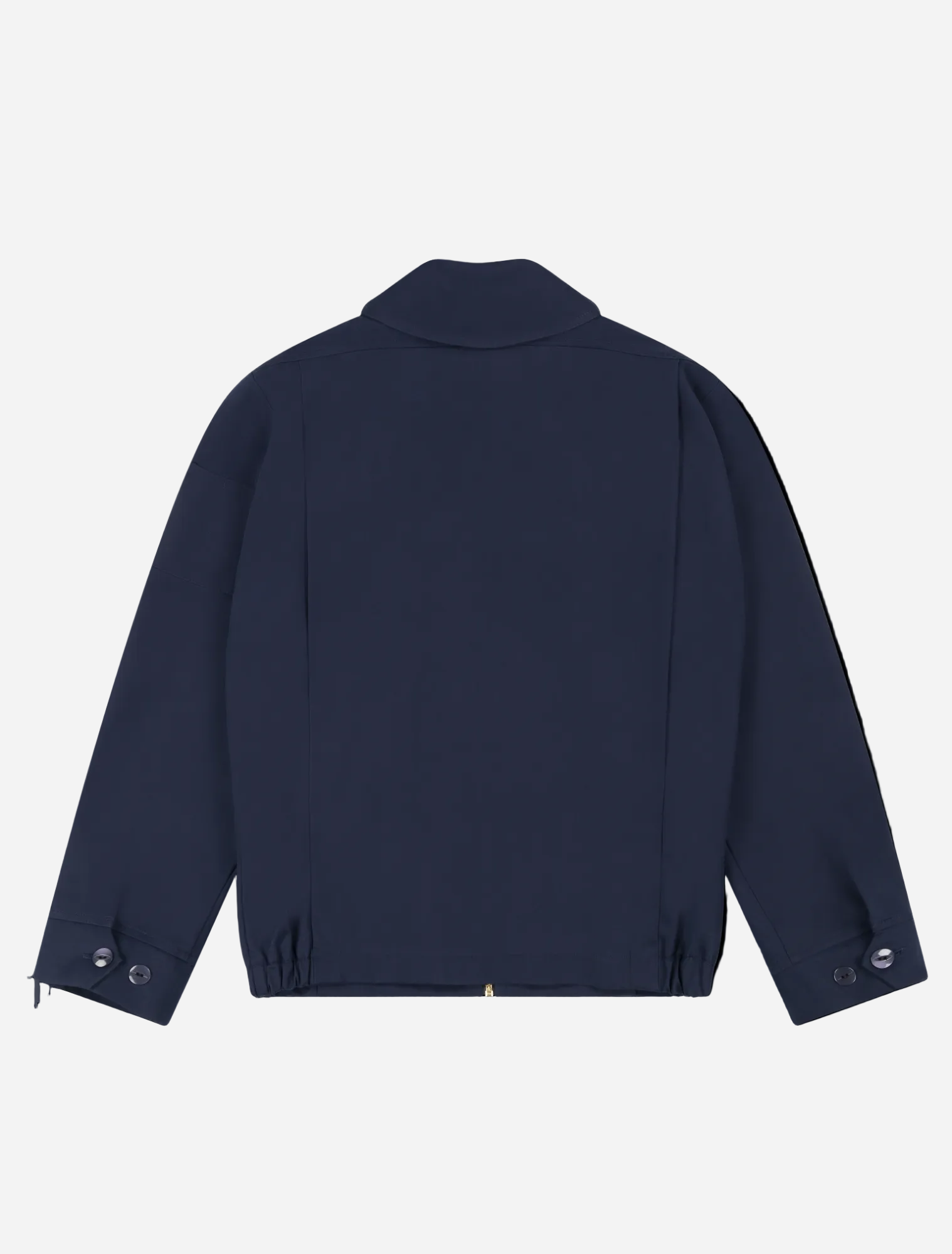 Robbyn unisex navy workwear jacket shown from the back, featuring a boxy fit, reinforced seams, adjustable buttoned cuffs, and minimal detailing.