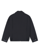 Robbyn unisex black workwear jacket shown from the back, featuring a boxy fit, reinforced seams, adjustable buttoned cuffs, and minimal detailing.