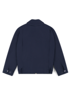 Robbyn unisex navy workwear jacket shown from the back, featuring a boxy fit, reinforced seams, adjustable buttoned cuffs, and minimal detailing.